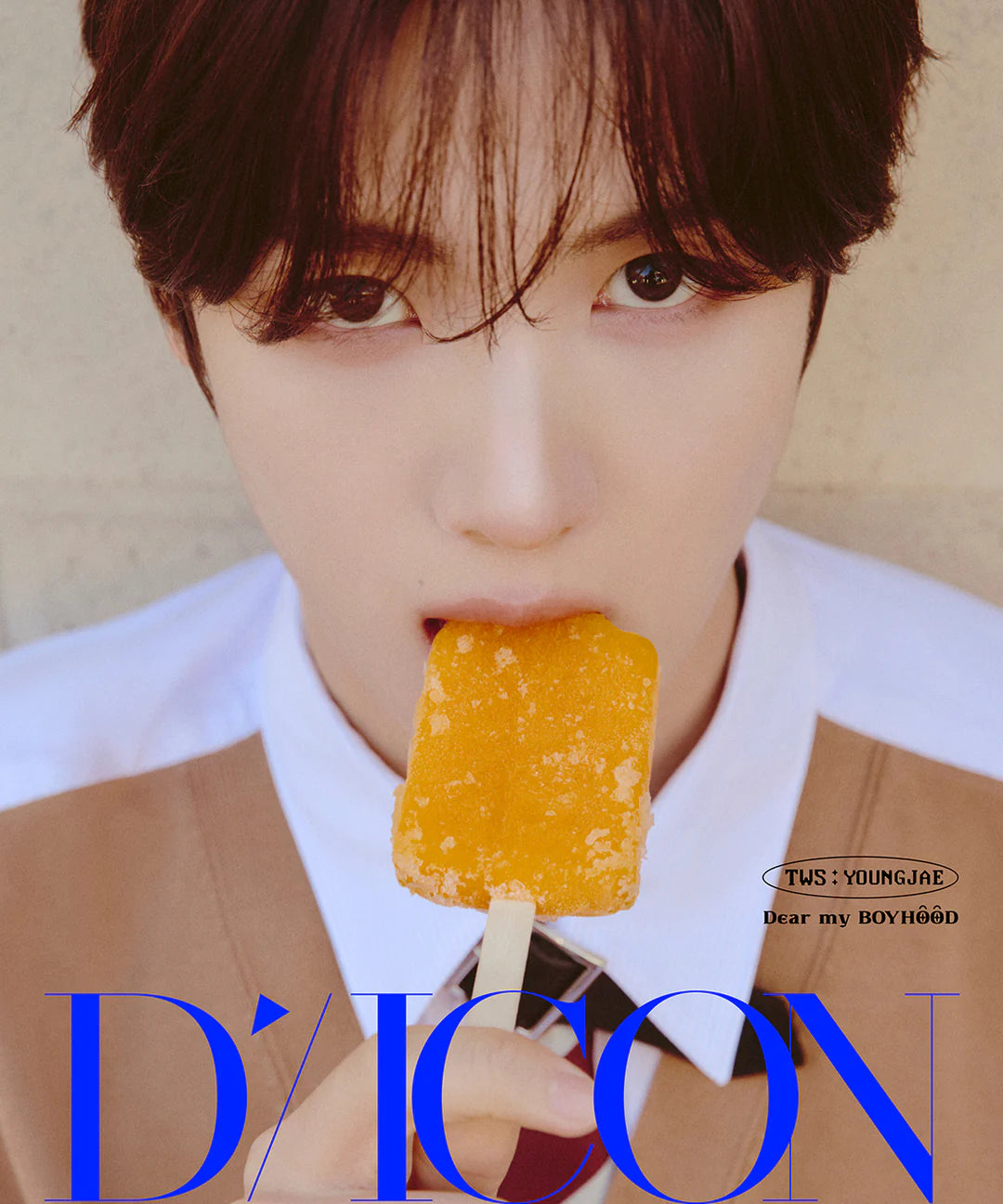 TWS's Youngjae holding a popsicle with 'D'Icon' branding in the foreground