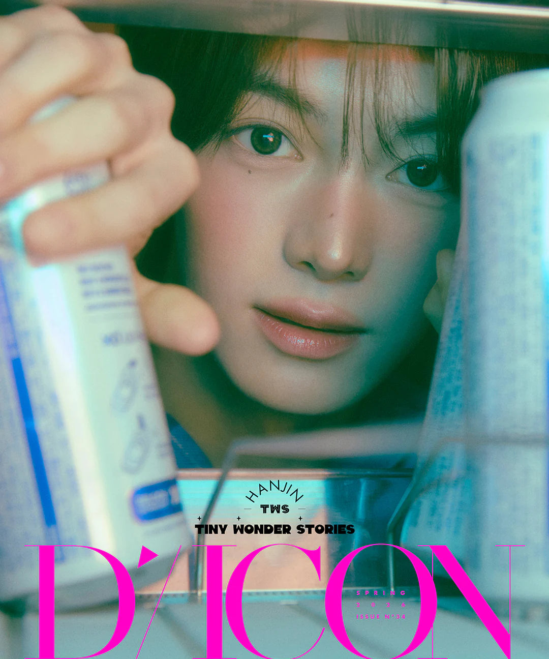 TWS'sHanjin holding a bottle with 'D'ICON' branding, framed by similar bottles in the foreground