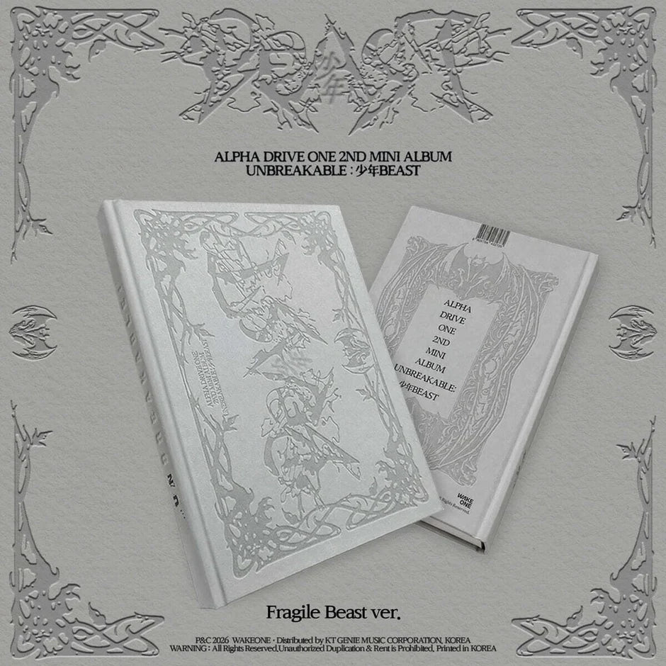 Alpha Drive One's 2nd Mini Album 'Unbreakable - Beast' Fragile Beast ver., showing a white photobook with detailed gray line art, set against a textured gray background with decorative corner borders.