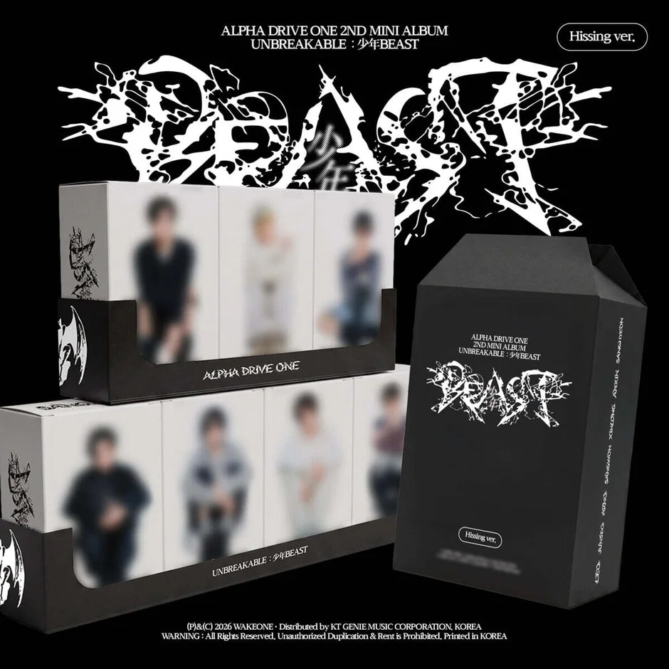 Alpha Drive One's 2nd Mini Album 'Unbreakable - BEAST' hiding ver. packaging display on a black background, featuring white and black boxes with blurred member photos and stylized white logo artwork.
