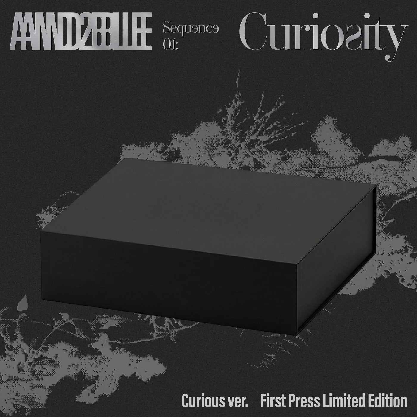 AND2BLE's 1st mini album packaging  showing one black box with text above and below on a dark background.