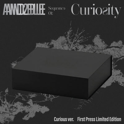 AND2BLE's 1st mini album packaging  showing one black box with text above and below on a dark background.