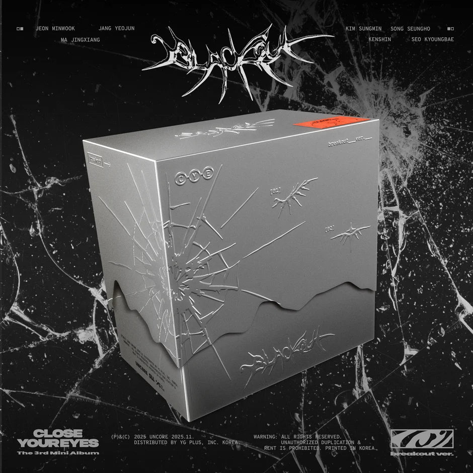 Gray box of CLOSE YOUR EYES's 3rd mini album with spider web design on a black marble background