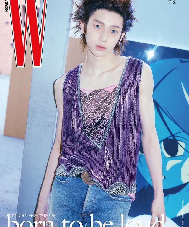 CORTIS's JUHOON wearing a sparkly purple top and blue jeans with a magazine cover in the background