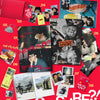 Merch inclusions for BTS's 'Are You Sure?' photobook with multiple items on a red background