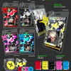 A promotional layout showing multiple NCT 127 'The 7th Album' mini keychains and accessories as album inclusions, including colorful star-patterned hang cards, a small acrylic case with individual members photos, and several printed photocards and stickers. Text labels identify the items and colors, and the layout is set on a dark background with NCT 127 branding.