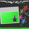 NCT 127 'Blingy' Jet Keychain Ver. album art featuring multiple metallic jet-shaped keychains in different colors (green, red, pink, silver, blue) on a dark gray background with album title text.