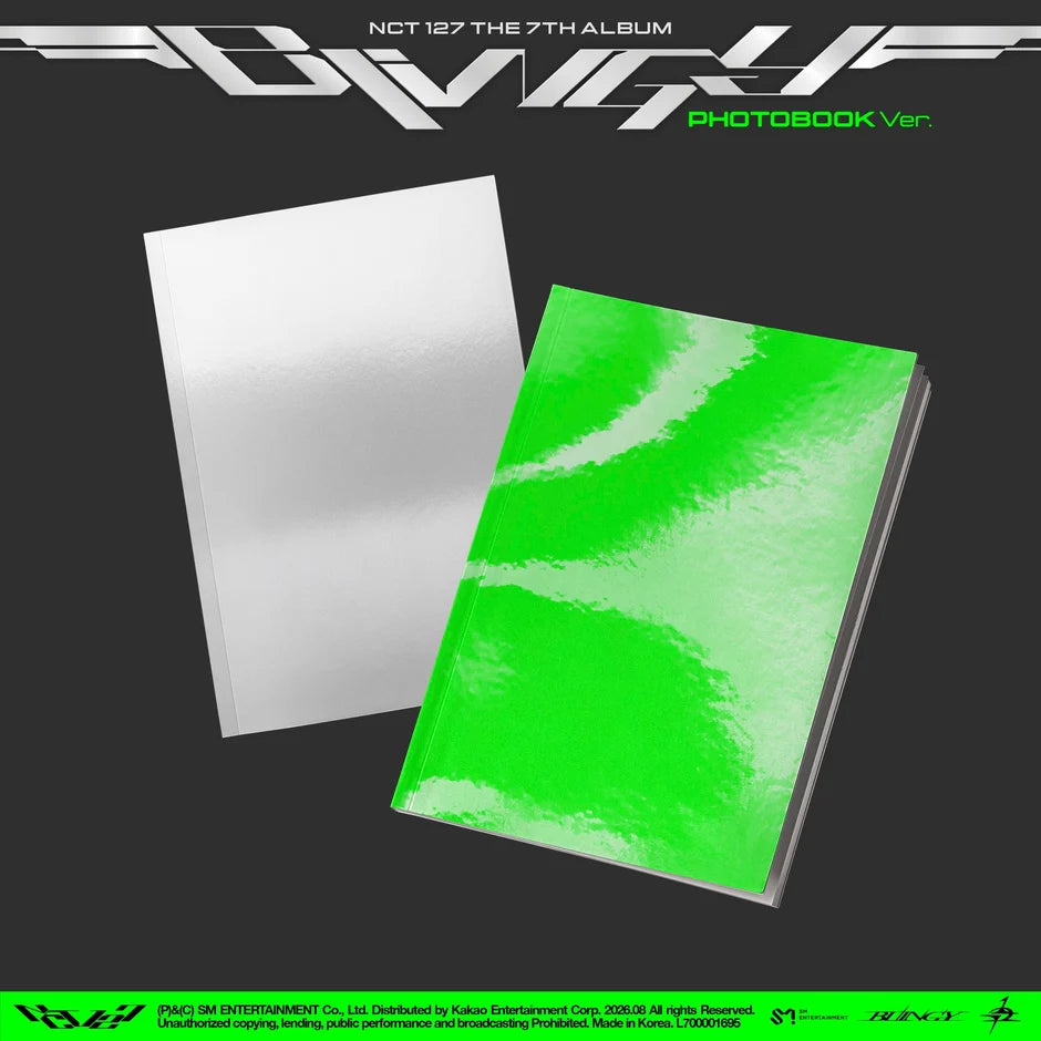 NCT 127's 7th Album Photobook Ver. featuring two album book covers on a dark gray background: one with a textured bright green cover and one with a plain white cover.