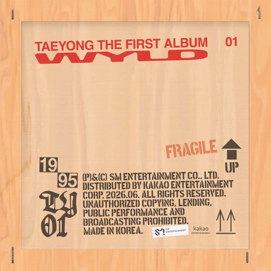 Wooden box with red and black text, resembling a packaging design for 'Taeyong The First Album'.