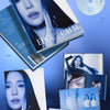 K-pop CD album package for Tiffany Young's 'EDGE of CALM' in a blue-toned flat lay layout. The image shows a CD, a photo book, and a folded poster on a blue gradient background.