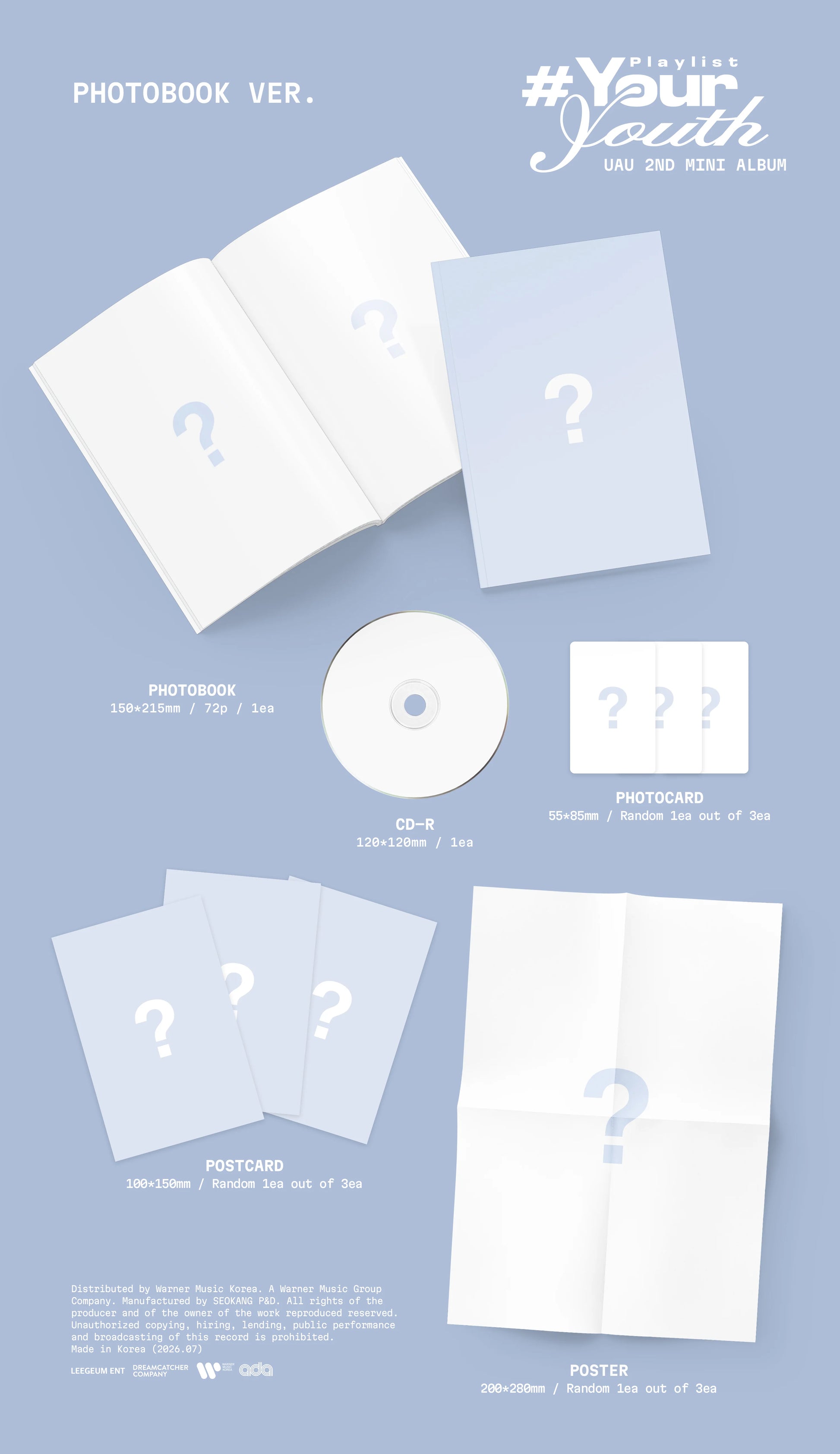DREAMCATCHER's UAU album packaging with CD, photocards and postcards on a light blue background