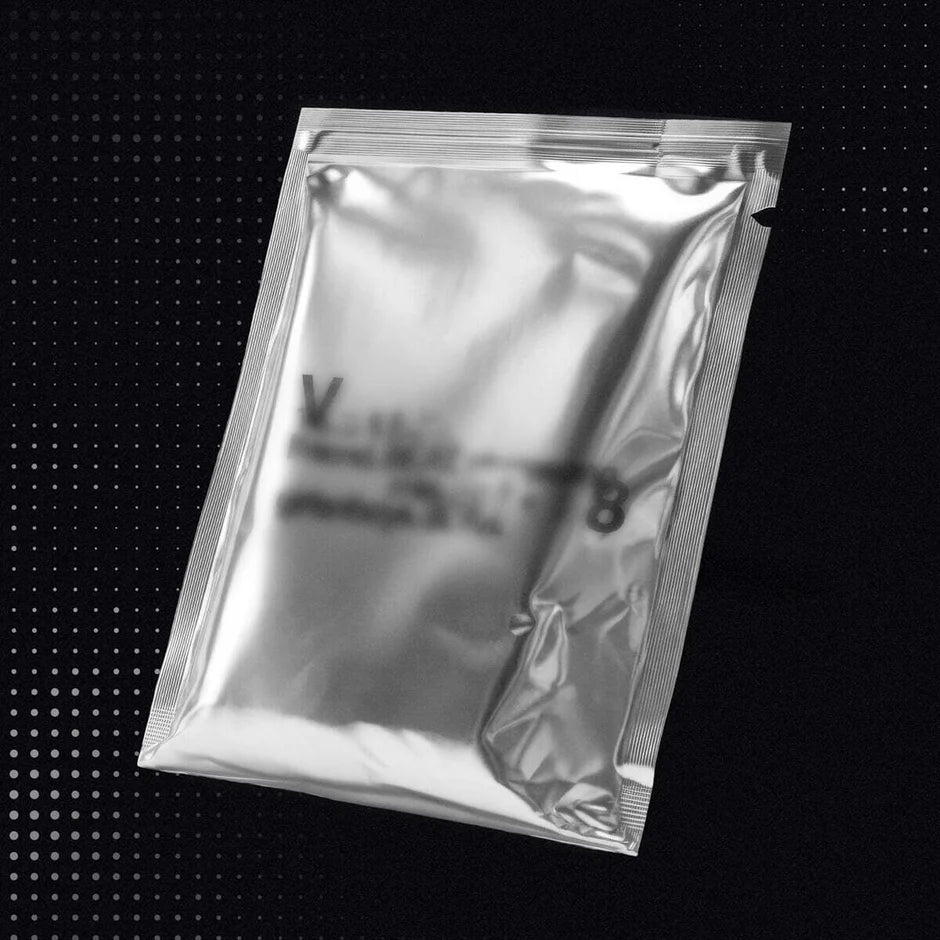 SEVENTEEN's V8 album silver foil packaging on a black background