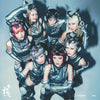 XG members in metallic costumes with horns against a gray background