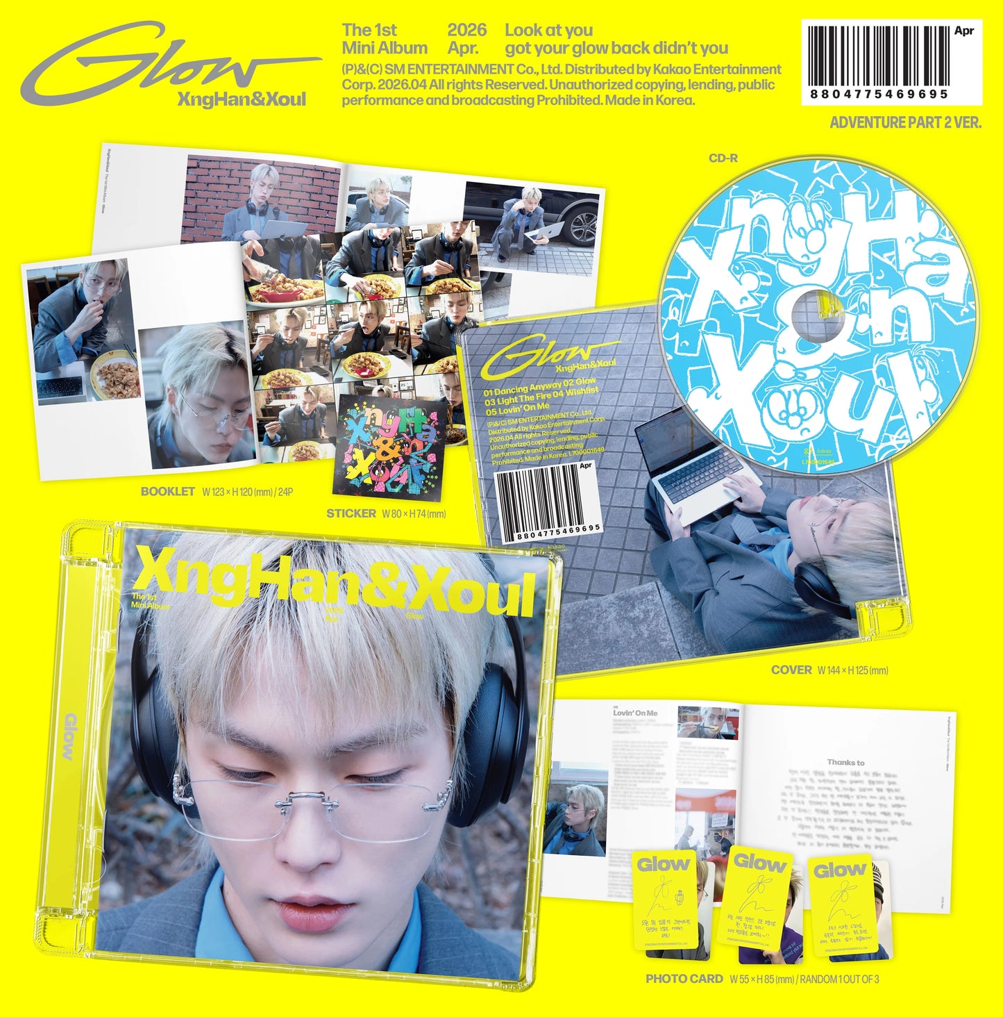 XngHan's Glow album packaging with photos, CD, and booklet on a yellow background