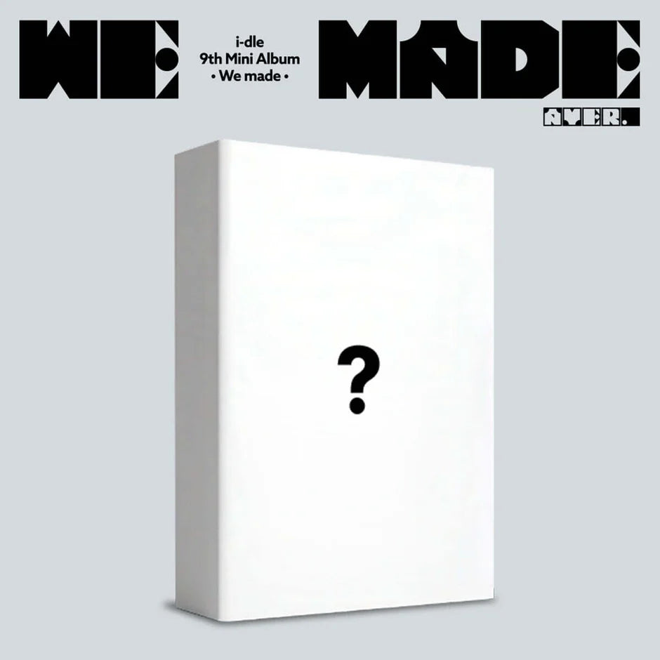 i-dle's white album box with a question mark on a light gray background, featuring album title and branding.