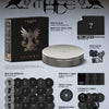i-dle's 9th mini album inclusions such as a round tin case, photo cards, and stickers on a gray background.